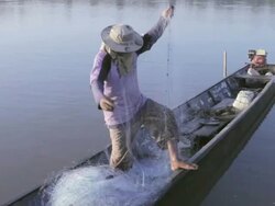 WS fisherman untangling net / Vientiane, Laos Stock Footage