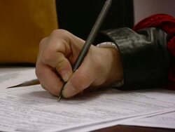 CU Hands of woman filling out forms seeking job at state run job center / Jackson, Michigan, United States  Stock Footage