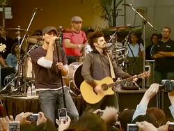 Enrique Iglesias Promotes Release of 'Insomniac' with Performance and Signing Stock Footage