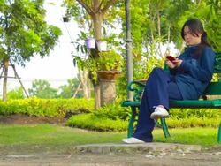 Dolly Shot:Girl play smart phone Stock Footage