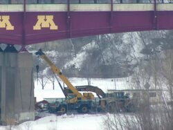 MS crane parked under University of Minnesota Washington Avenue Bridge / Minneapolis, Minnesota, United States Stock Footage