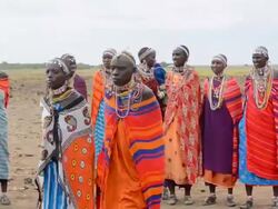 MS Masai women welcome to village Amboseli Maasai / Amboseli National Park, Kenya Stock Footage