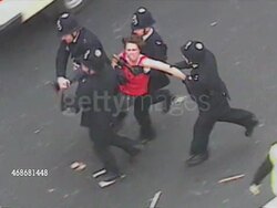 Police Officers Carrying Away Anti-Poll Tax Protester News Clip