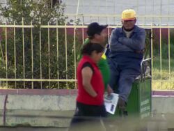 CU of Shoeshiner sitting on seat waiting for custom, Cochabamba, Bolivia Stock Footage