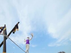 MS LA PAN Shot of tightrope walker doing acrobatics on high wire / Gyeonggido, South Korea Stock Footage