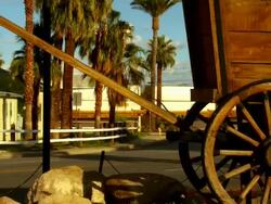 CU, ZO, MS, Needles California sign on side of western pioneer wagon at entrance to city of Needles, California, USA Stock Footage