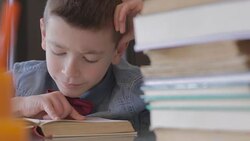 Boy doing homework Stock Footage