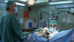 Surgeons operating a patient Stock Footage