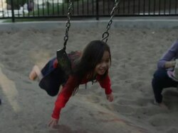 USA, California, San Francisco, Alamo Square Park, Girl (4-5) swinging in playground Stock Footage