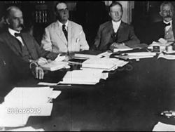 1920: POLITICS: PAN Members of US Senate Foreign Relations Committee sitting at conference table (Warren G. Harding 2nd left, chairman Henry Cabot Lodge at head). MS Henry Cabot Lodge, Sr. sitting in chair (film lines).  League of Nations opposition Instructional Video