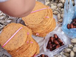 MS Shot of piles of cassava crackers with hands moving around and taking some crackers / Luang Prabang, Laos Stock Footage