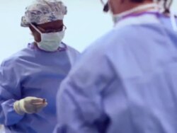 Doctors performing a surgery Stock Footage