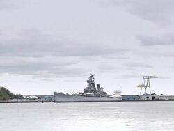 Battleship on Delaware River seen from Philadelphia Stock Footage