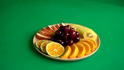 mixed fruit on wood plate Stock Footage