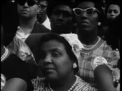 B/W August 28, 1963 close up Black people in crowd at March on Washington / Washington Monument in background Stock Footage