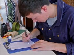 Fashion Designers drawing and sketching On New Dress Stock Footage