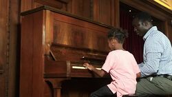 Father and Daughter play piano Stock Footage