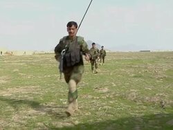 WS ZI Soldiers walking in landscape / Mausa Qala, Helmand Province, Afghanistan. Stock Footage