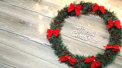 Christmas wreath with decorations on the shabby wooden background Stock Footage