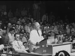 1948: DEMOCRATIC NATIONAL CONVENTION: President Harry S Truman behind podium repeating he'll call Congress back to pass laws, high prices, meet housing crisis, aid to education, national health program, Civil Rights legislation, minimum wage increase Instructional Video