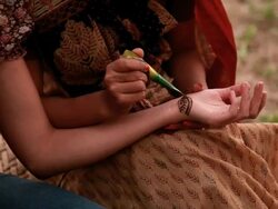 Two young women applying henna, Haryana, India Stock Footage
