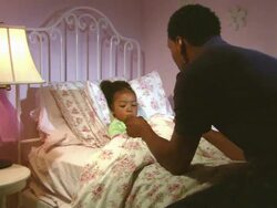 MS, father taking daughter's (4-5) temperature in bed, Westfield, New Jersey, USA Stock Footage
