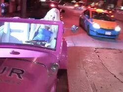 Courtney Stodden poses in 1933 Plymouth Hot Rod Roadster at Sur Lounge in West Hollywood Stock Footage