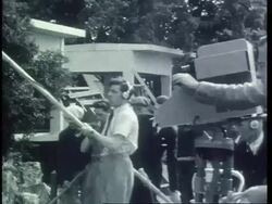 Presenters touring 1939 Chelsea Flower Show Stock Footage