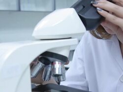 HD : Scientist using microscope Stock Footage