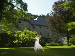 HD DOLLY: Young Ballerina Dancing In The Park Stock Footage