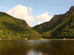 Mountain Cliffs and Lake - Timelapse Stock Footage