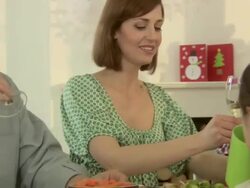 Family toasting glasses and having christmas dinner Stock Footage