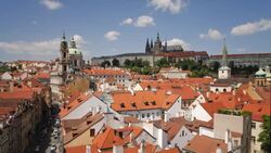 Drifting clouds cast shadows on rooftops in the Prague cityscape. Stock Footage