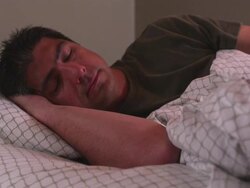MS Man in bed sleeping, then turning over / Portland, Oregon, United States Stock Footage