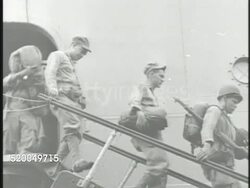 1950: KOREAN WAR: U.S. MARINES: VS United States Navy transport ship in port in city of Pusan, 1st Marines mobilizing at port, crane moving military truck. South Korea, 38th Parallel, aka Busan, port city Instructional Video