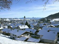 WS Shot of snow on roof on houses in town in winter / Nesselwang, Bavaria, Germany Stock Footage