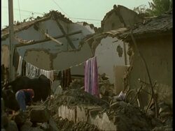 MS rubble of demolished house, washing line draped across, after earthquake, Gujarat, India Stock Footage
