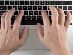 man typing on a keyboard Stock Footage