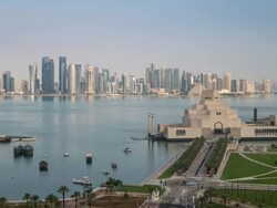 Elevated view over the Museum of Islamic Art and the Dhow harbour to the modern skyscraper skyline, Doha, Qatar, Middle East Stock Footage