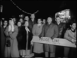 B/W 1955 PAN crowd of onlookers behind police line at premiere of "The Benny Goodman Story" / news. Stock Footage