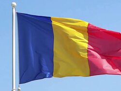 MS SLO MO Shot of Rumanian flag waving in wind / Caen, Normandy, France Stock Footage