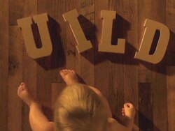 baby completes the word "BUILD" Stock Footage