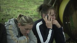 Worried families gather at collapsed coal mine for news of men trapped underground News Clip