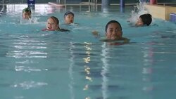 Children Swimming in a Pool at a Fitness Centre Stock Footage