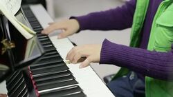 boy playing the piano Stock Footage