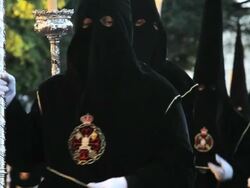 Hooded Nazarenos parade during the celebration of Semana Santa a Holy week in Malaga Spain, Europe Stock Footage