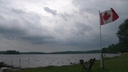 Severe Thunderstorms Approaching A Lake In Canada Stock Footage
