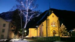 Christmas lights twinkle in a tree in Chamonix, France. Stock Footage