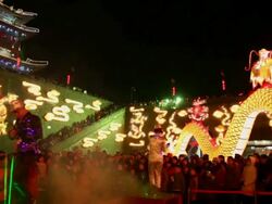 MS PAN People dancing at city wall new year lantern festival  AUDIO  / xi'an, shaanxi, china Stock Footage