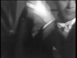 B/W 1933 close up man in formalwear shaking drink in cocktail shaker / end of Prohibition Stock Footage
